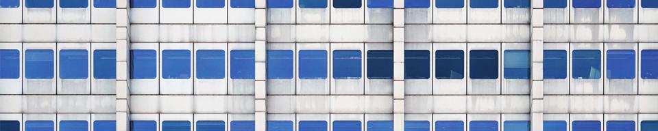 Grey office with blue windows Grey office with blue windows